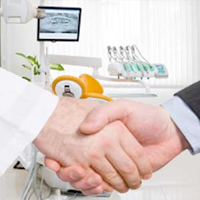 Dentist and patient shaking hands in a dental clinic