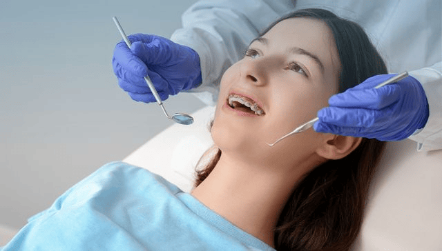 Orthodontist examining Class II Division 2 malocclusion for treatment